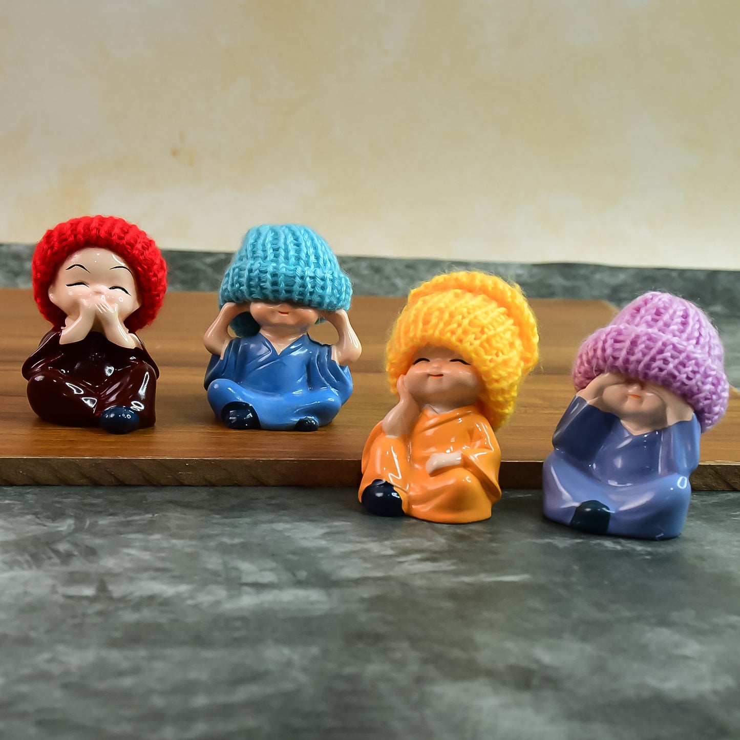 Decorative Resin Monk Buddha Showpiece Set Of 4 With Traditional Straw Hats