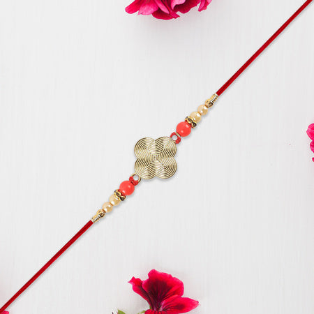 Rakhi With Multicolor Beads  Silver Accents On Red Thread