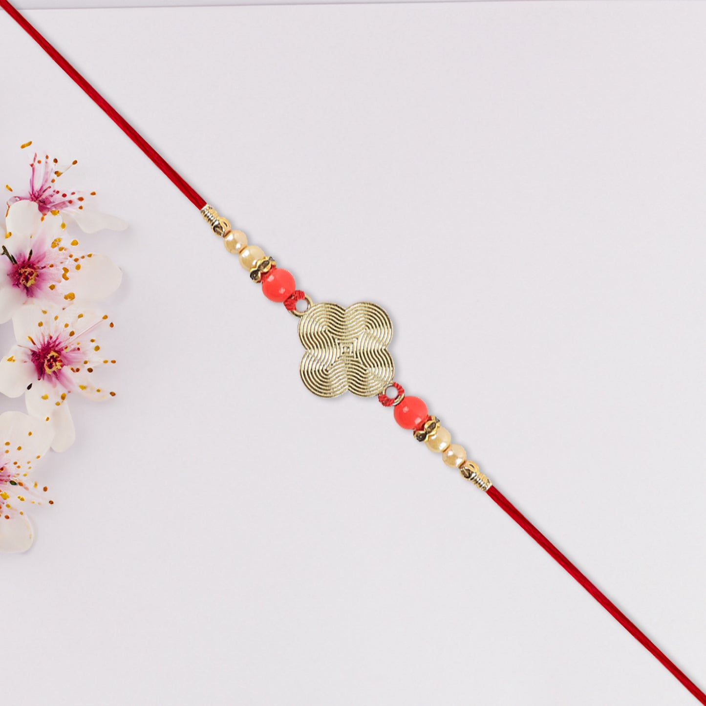 Rakhi With Multicolor Beads  Silver Accents On Red Thread