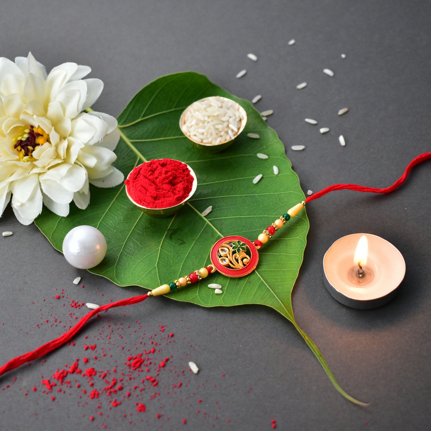 Traditional Circular Meenakari Rakhi With Floral Motif And Beaded Thread