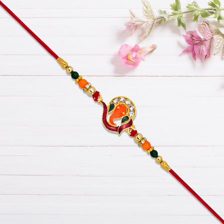 Golden Ganesha Rakhi With Red-green Beads And Stone Detailing