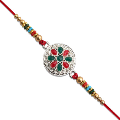 Silver Plated Floral Rakhi With Red  Green Stones