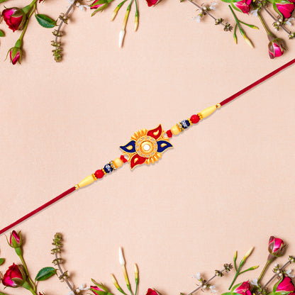 Designer Sun Motif Rakhi With Red And Blue Enamel Work