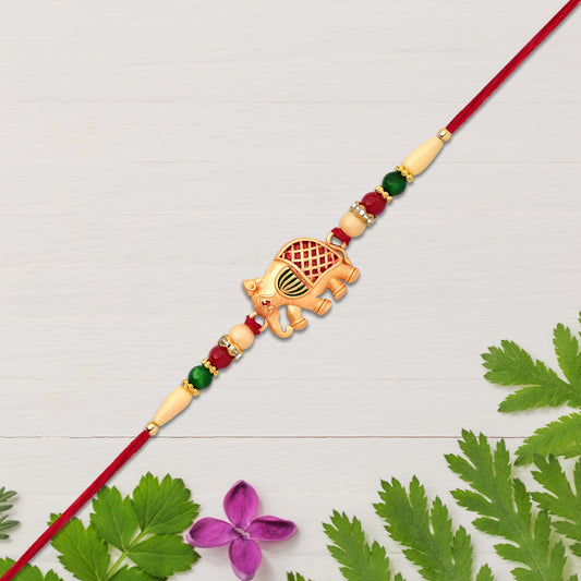 Golden Elephant Rakhi With Red Green Moti