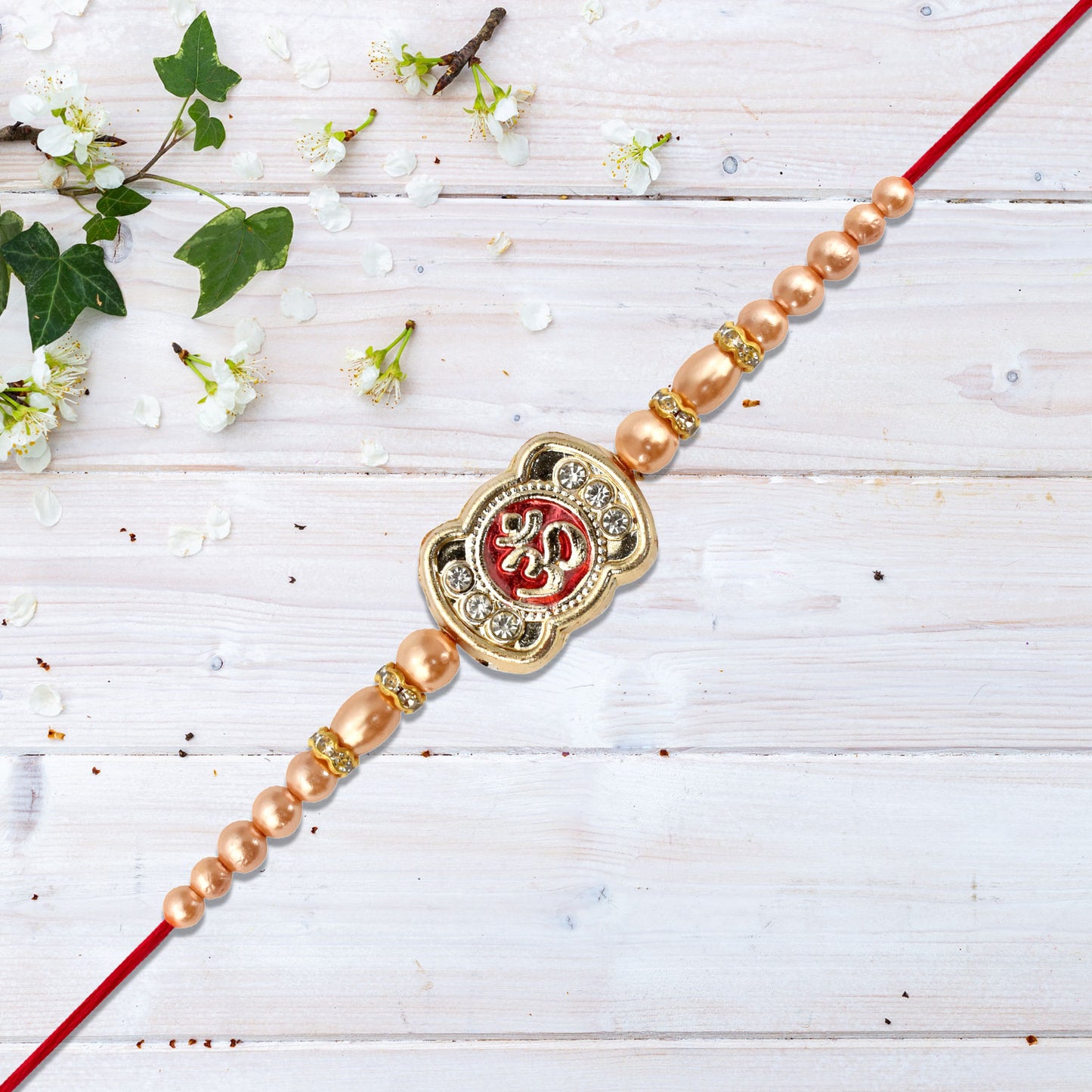 Om Rakhi With Stone Embellishments  Golden Beads